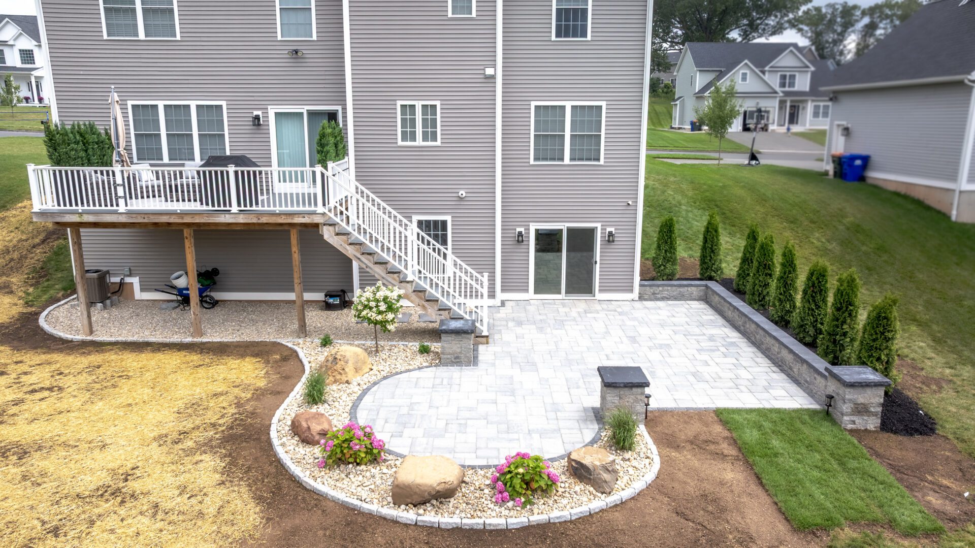 Finished custom patios Cheshire CT with retaining wall